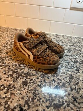 Cat & Jack Leopard Print with gold, white, cream brown.